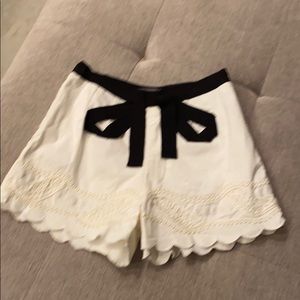 Off white lace detail shorts with black bow